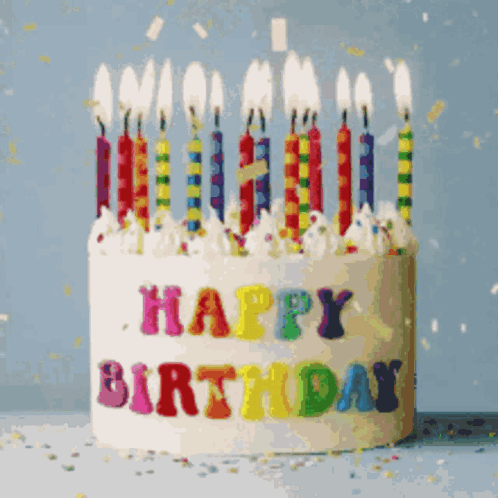 A Birthday Cake With Candles That Say Happy Birthday On It GIF