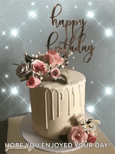 A Birthday Cake With Flowers And A Happy Birthday Sign GIF