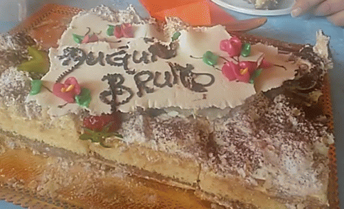 A Birthday Cake With The Name Bruno On It GIF