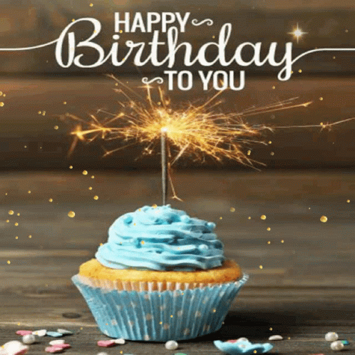 A Birthday Card With A Cupcake And A Sparkler GIF