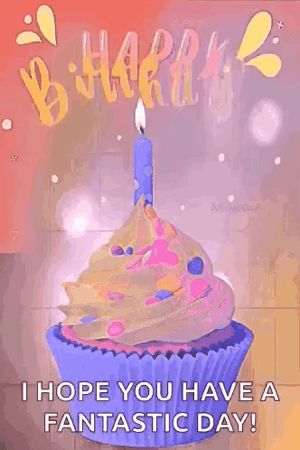 A Birthday Cupcake With A Candle On Top Of It . GIF