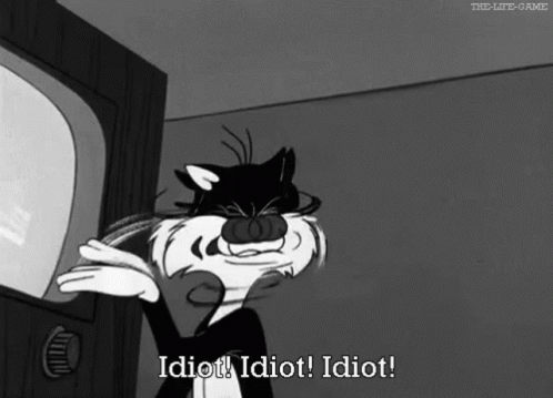 A Black And White Cartoon Of A Cat Saying Idiot GIF