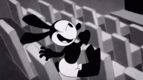 A Black And White Cartoon Of A Rabbit Sitting On A Row Of Seats GIF
