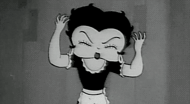 A Black And White Cartoon Of Betty Boop Is Making A Funny Face . GIF