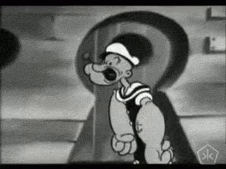 A Black And White Cartoon Of Popeye The Sailor Is Standing In Front Of A Large Keyhole . GIF