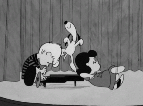 A Black And White Cartoon Of Snoopy And Lucy Playing Piano GIF