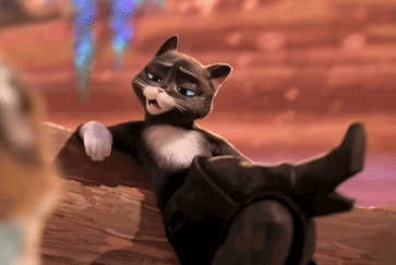 A Black And White Cat Is Sitting On A Log GIF