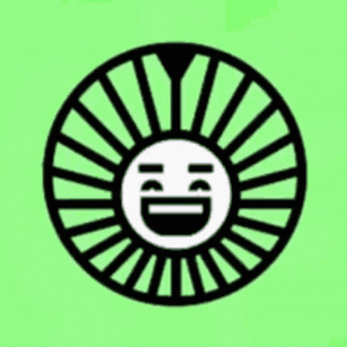 a black and white circle with a smiley face in the middle on a green background .