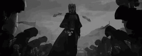 A Black And White Drawing Of A Man In A Mask Standing In Front Of A Crowd Of People . GIF
