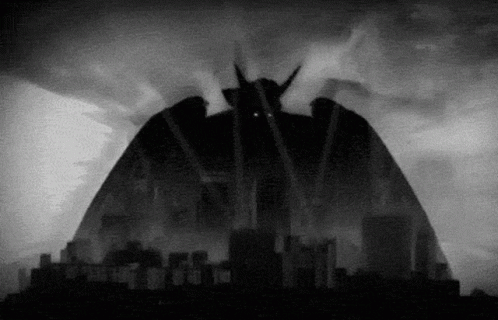 A Black And White Drawing Of A Monster With Horns GIF