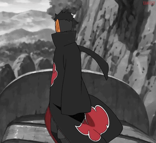 A Black And White Drawing Of A Person With A Red Cloud On The Back Of Their Coat GIF