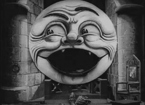 A Black And White Drawing Of A Smiling Face In Front Of A Castle Tower GIF