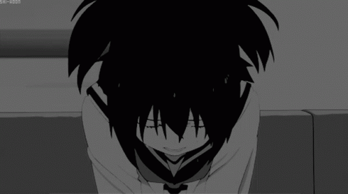 a black and white image of a person covering their face