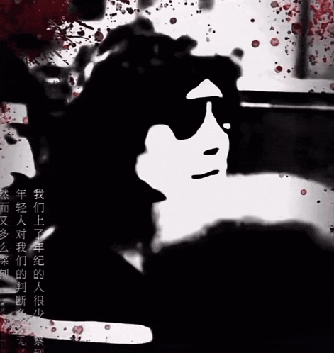 A Black And White Image Of A Person 'S Face With Blood Splashing Around It GIF