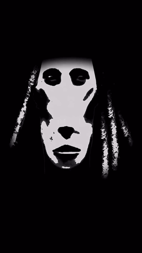 A Black And White Image Of A Person 'S Face With Dreadlocks GIF