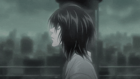A Black And White Image Of A Person With Long Hair Standing In Front Of A City . GIF