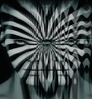 A Black And White Optical Illusion Of A Person 'S Eyes GIF
