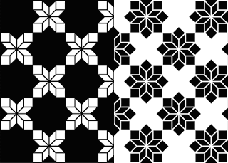 A Black And White Pattern Of Snowflakes On A Black And White Background GIF