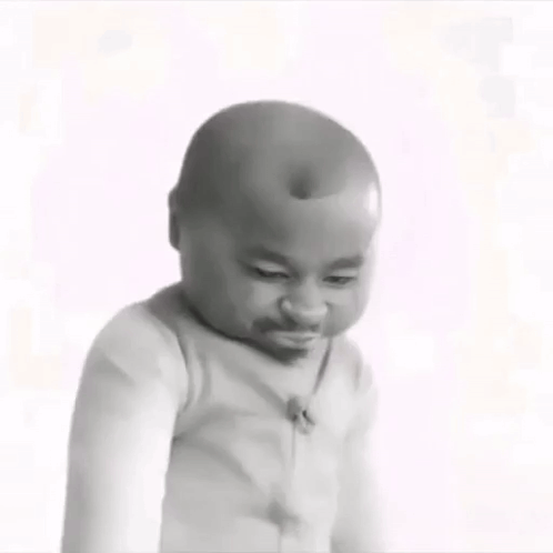 A Black And White Photo Of A Baby Making A Funny Face With His Eyes Closed . GIF