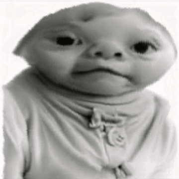 A Black And White Photo Of A Baby Wearing A Sweater With A Smiley Face On It . GIF