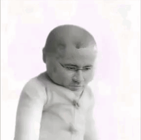 A Black And White Photo Of A Baby With A Bald Head GIF