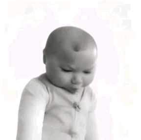 A Black And White Photo Of A Baby With A Bald Head . GIF