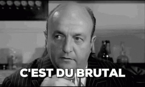 A Black And White Photo Of A Bald Man In A Suit And Tie With The Words `` C'est Du Brutal '' Written On It . GIF