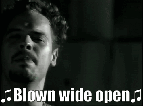 A Black And White Photo Of A Band With The Words Blown Wide Open Below Them GIF