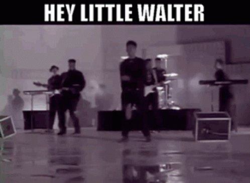 A Black And White Photo Of A Band With The Words Hey Little Walter Below Them GIF