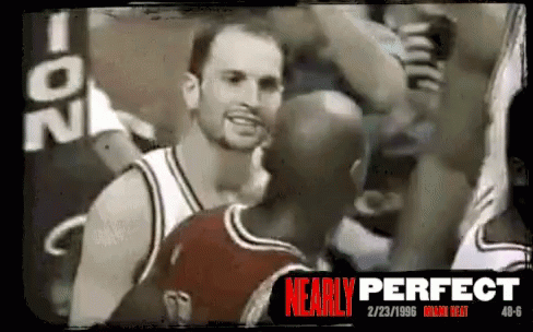 A Black And White Photo Of A Basketball Player With Nearly Perfect Written In Red GIF