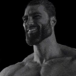 A Black And White Photo Of A Bearded Man Smiling . GIF