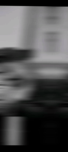 A Black And White Photo Of A Blurred Background With A Few Lines Coming Out Of It . GIF
