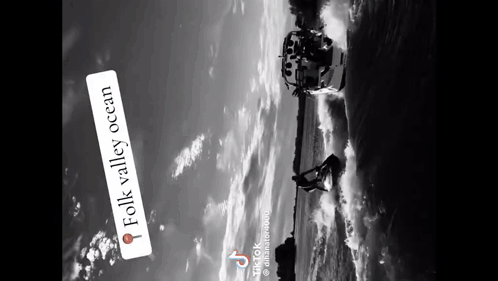 A Black And White Photo Of A Boat In The Water With The Words Folk Valley Ocean Below It GIF