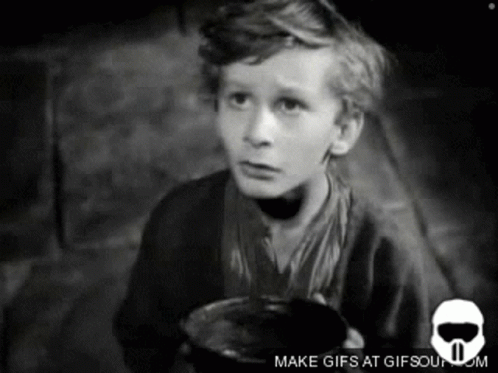 A Black And White Photo Of A Boy Holding A Cup With The Words Make Gifs At Gifsoun.com Below Him GIF