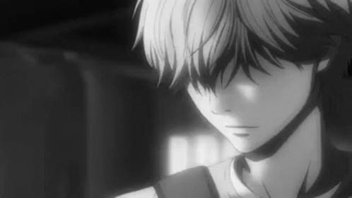 A Black And White Photo Of A Boy With A Backpack Looking Down . GIF