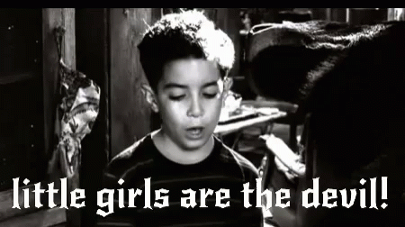 A Black And White Photo Of A Boy With The Words `` Little Girls Are The Devil '' Written On It . GIF