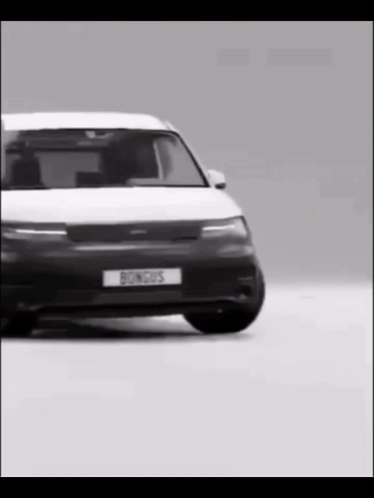A Black And White Photo Of A Car With A License Plate That Says Bongus GIF