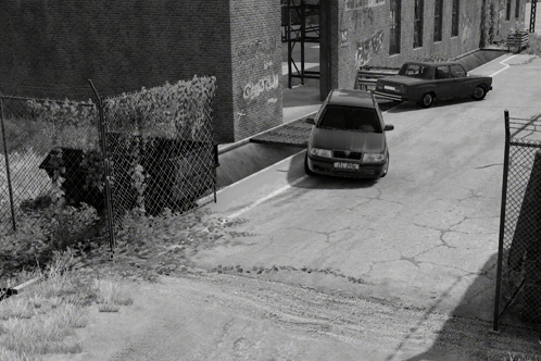 A Black And White Photo Of A Car With A License Plate That Starts With The Letter S GIF