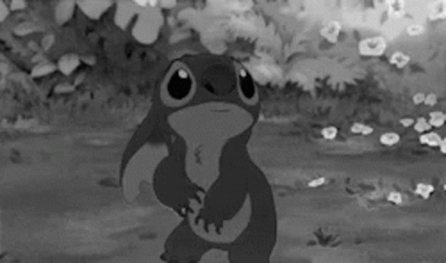 A Black And White Photo Of A Cartoon Character Stitch GIF