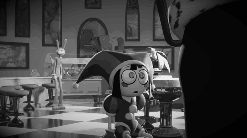 A Black And White Photo Of A Cartoon Character Wearing A Jester 'S Hat . GIF