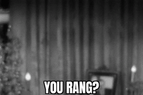A Black And White Photo Of A Christmas Tree With The Words `` You Rang ? '' GIF