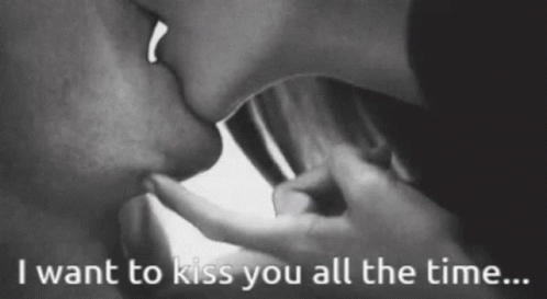 A Black And White Photo Of A Couple Kissing With The Words " I Want To Kiss You All The Time " GIF