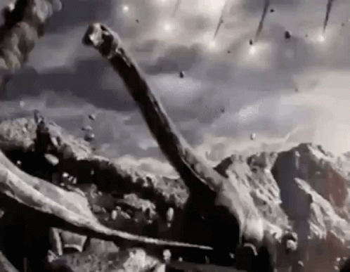 A Black And White Photo Of A Dinosaur Standing On Top Of A Rocky Hill . GIF