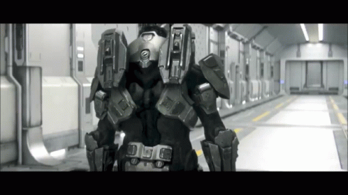 A Black And White Photo Of A Futuristic Soldier With The Letter A On The Back Of His Helmet GIF