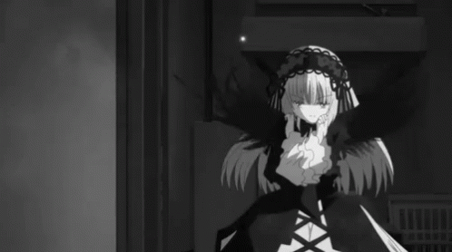A Black And White Photo Of A Girl In A Gothic Outfit GIF