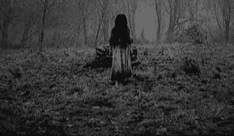 A Black And White Photo Of A Girl With A Ring On Her Finger . GIF
