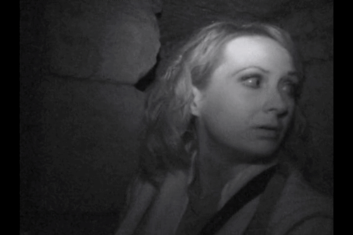 A Black And White Photo Of A Gray Background With A Few Lines On It . GIF