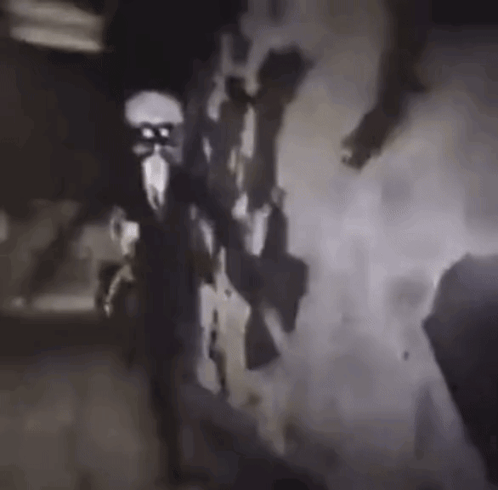 A Black And White Photo Of A Group Of People Holding Guns In A Dark Room . GIF
