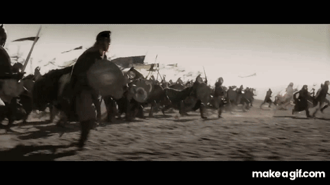 A Black And White Photo Of A Group Of Soldiers Fighting In A Field . GIF