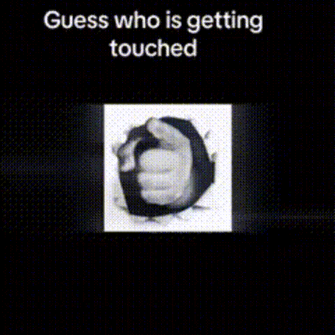 A Black And White Photo Of A Hand Sticking Out Of A Hole In The Wall . GIF